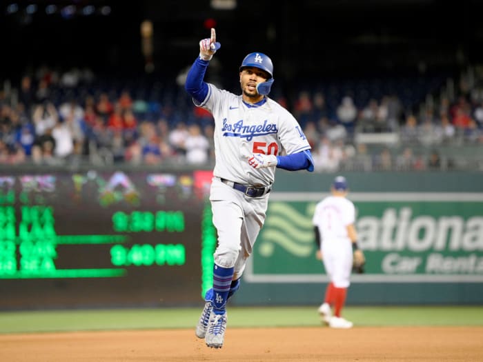 Los Angeles Dodgers’ Mookie Betts celebrates his home run during the fourth inning of a baseball game against the Washington Nationals, Tuesday, May 24, 2022, in Washington.